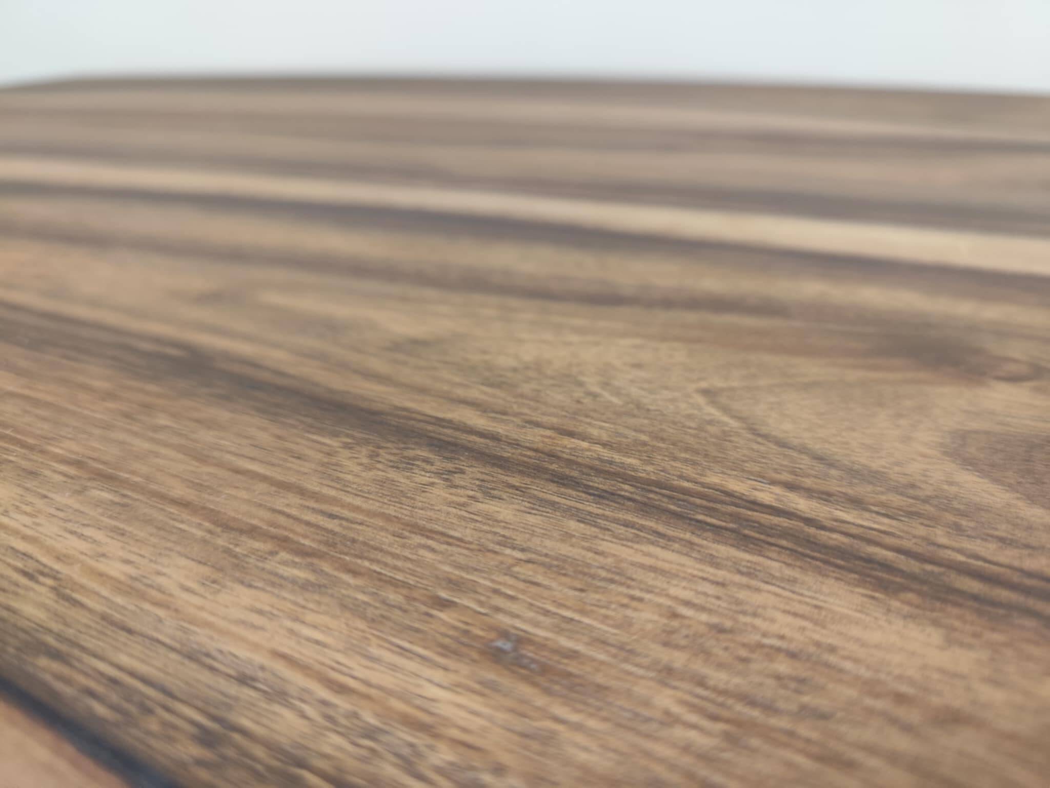 Round walnut table convertible into a console.