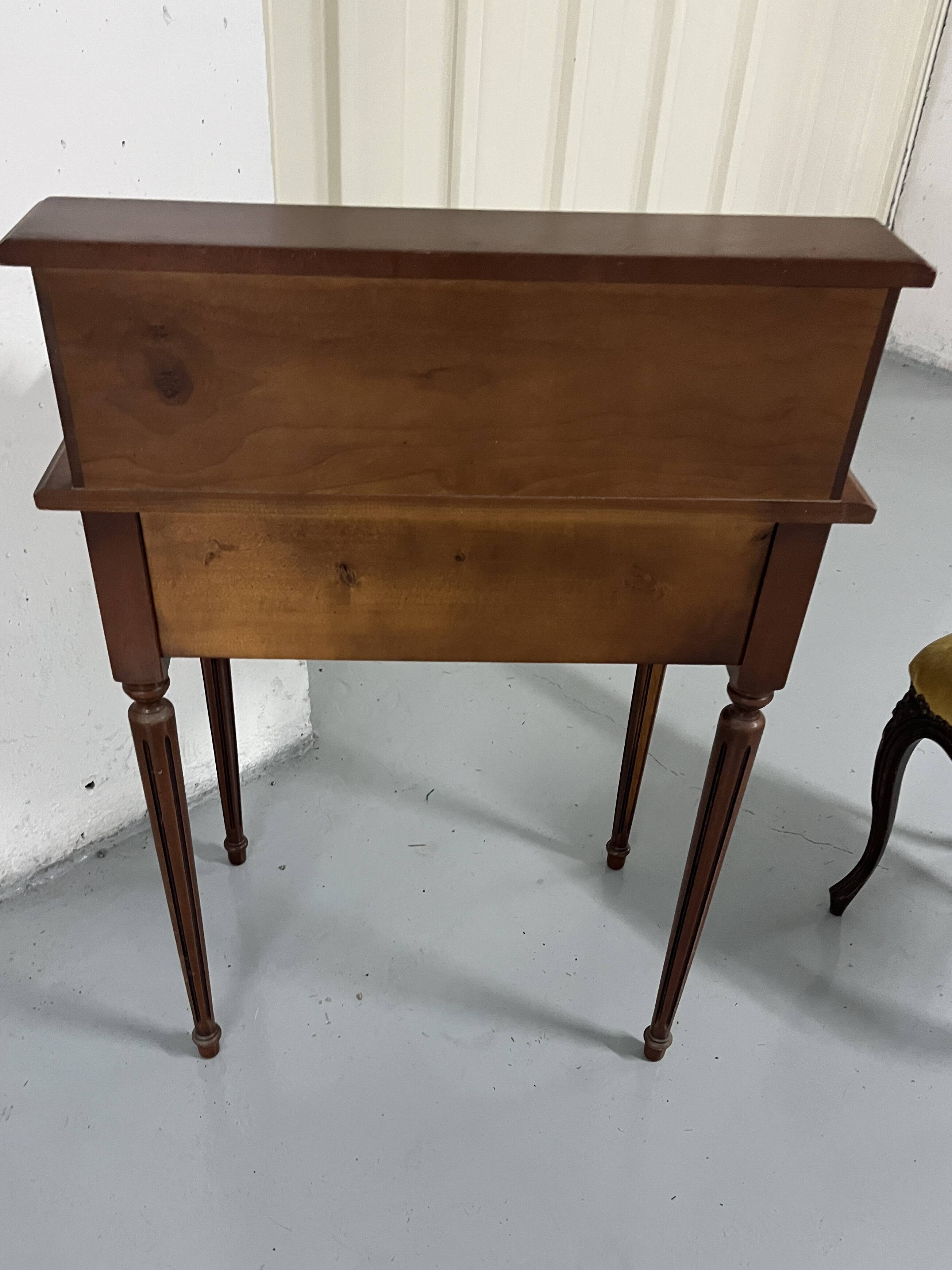 Old-fashioned secretary desk and chair set.
