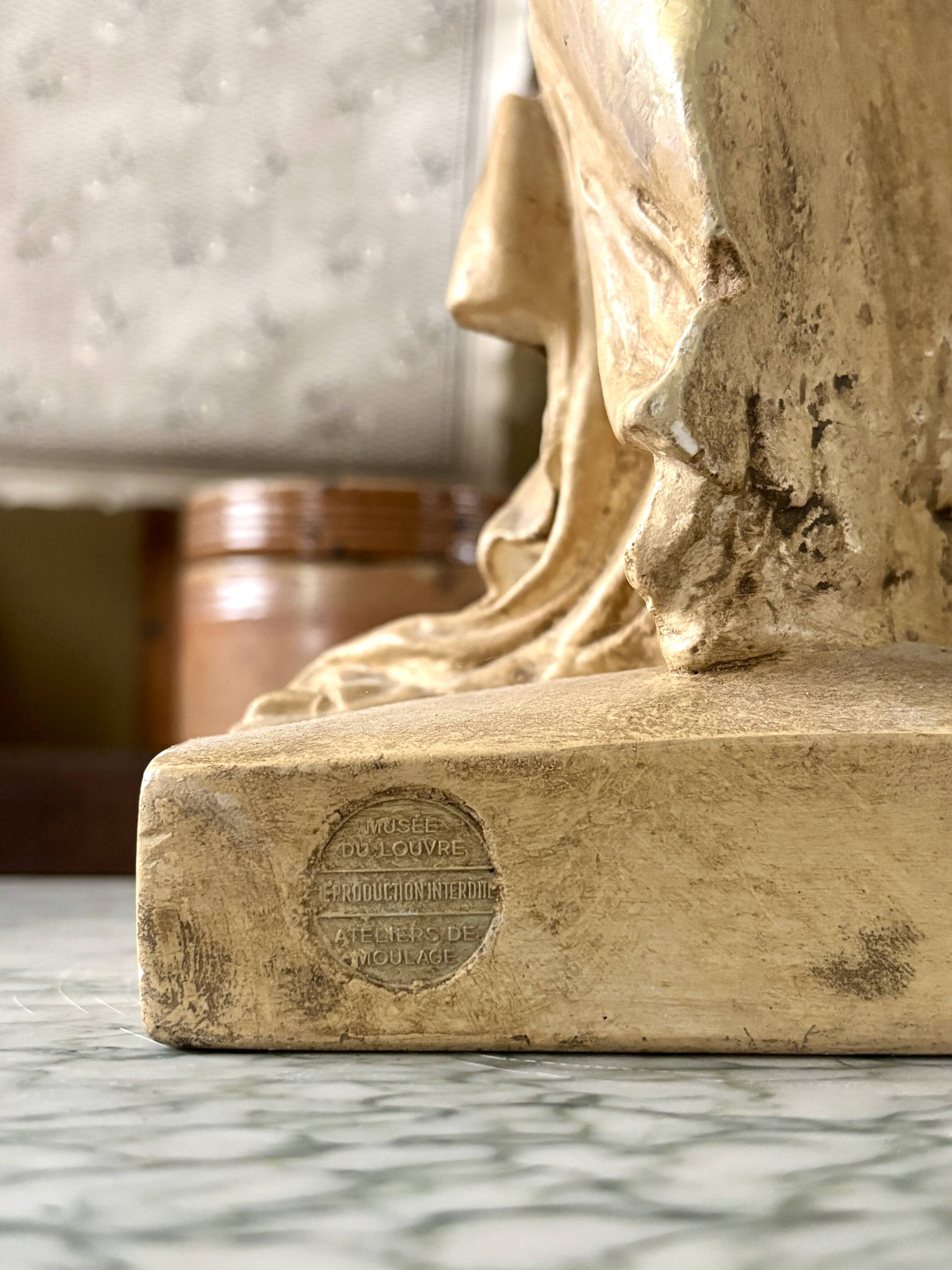 "Winged Victory of Samothrace", beige plaster statuette