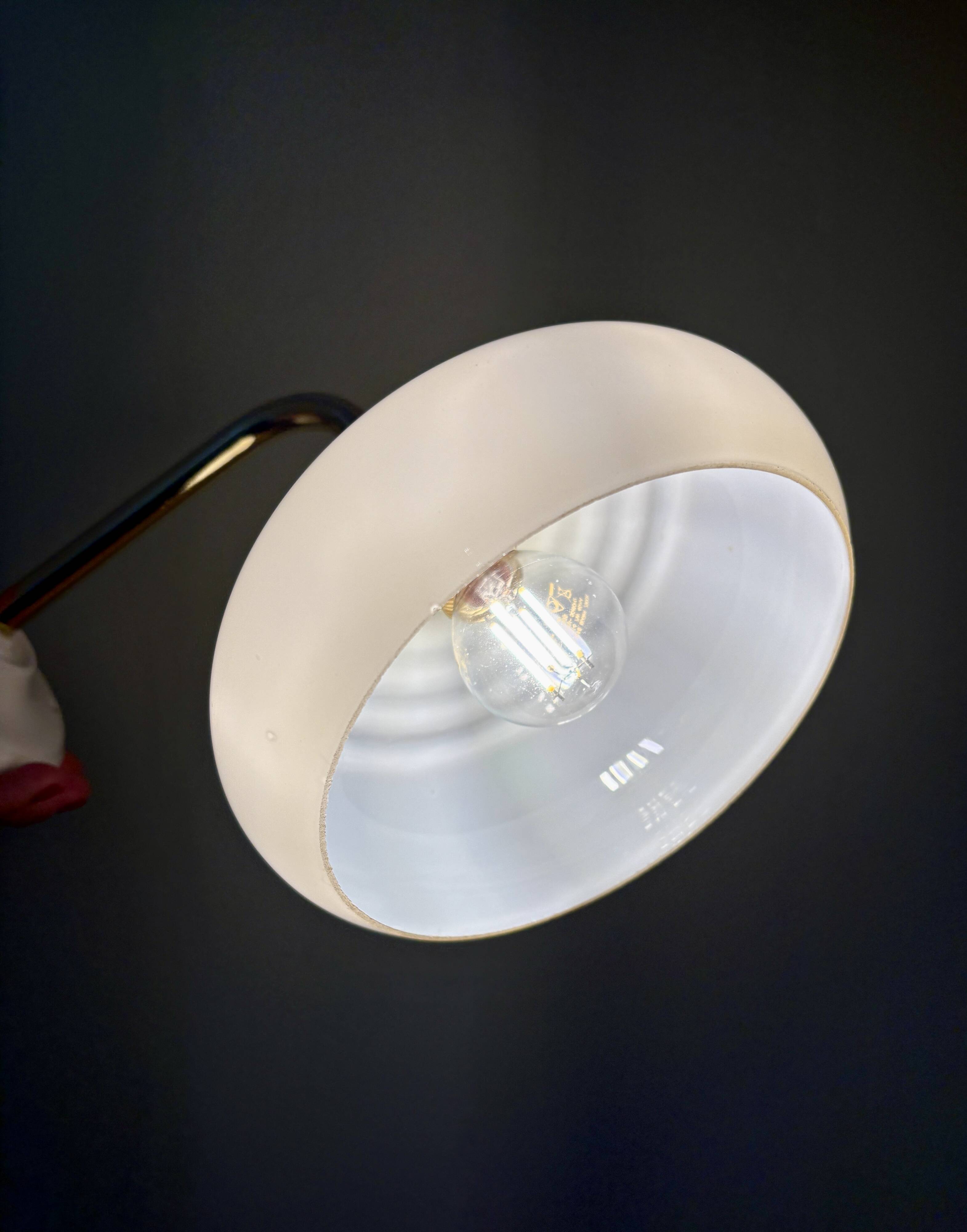 Vintage angled wall lamp with pale yellow opaline shade
