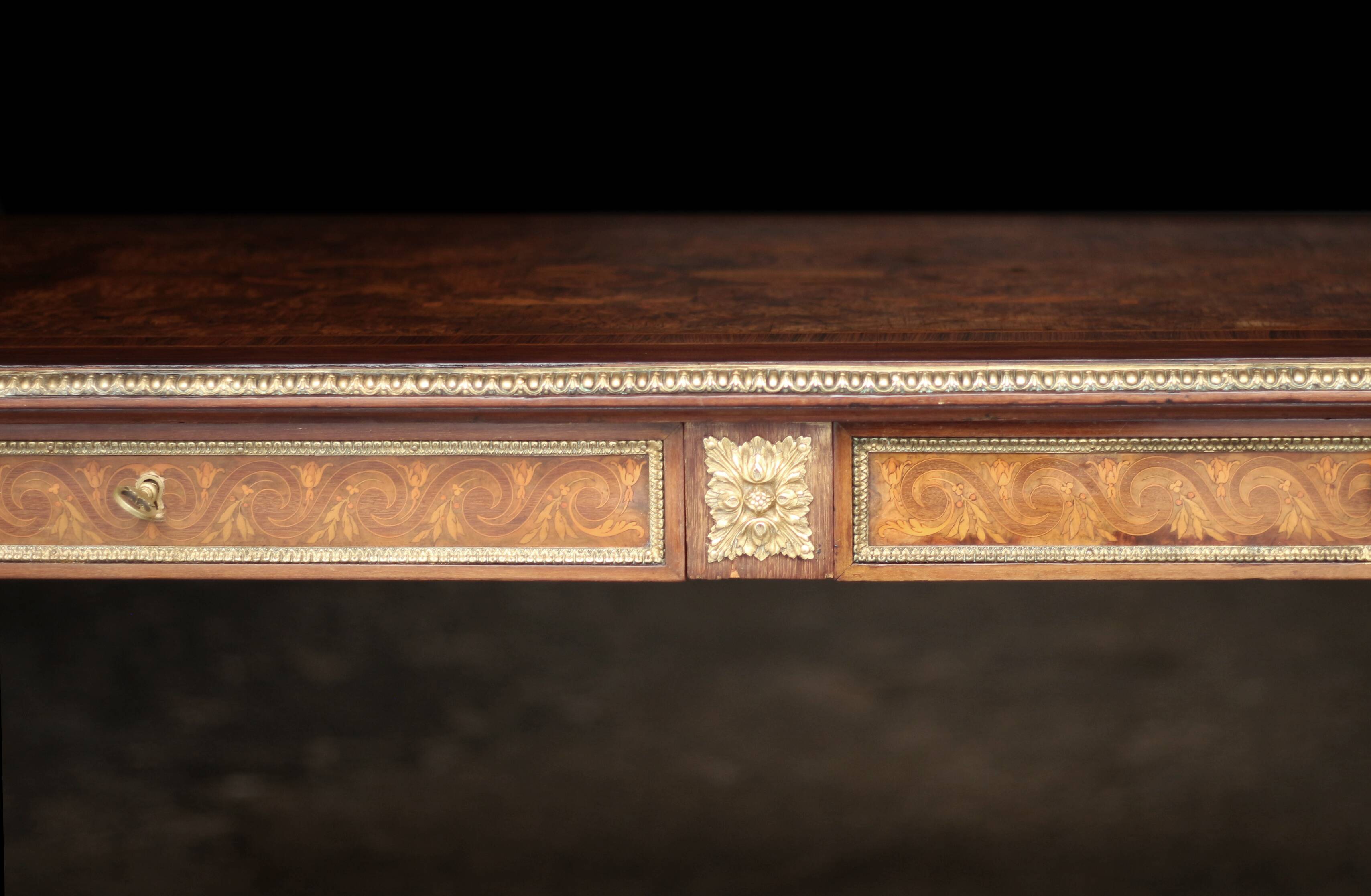 Superb Napoleon III table. Marquetry top and gilded bronzes.