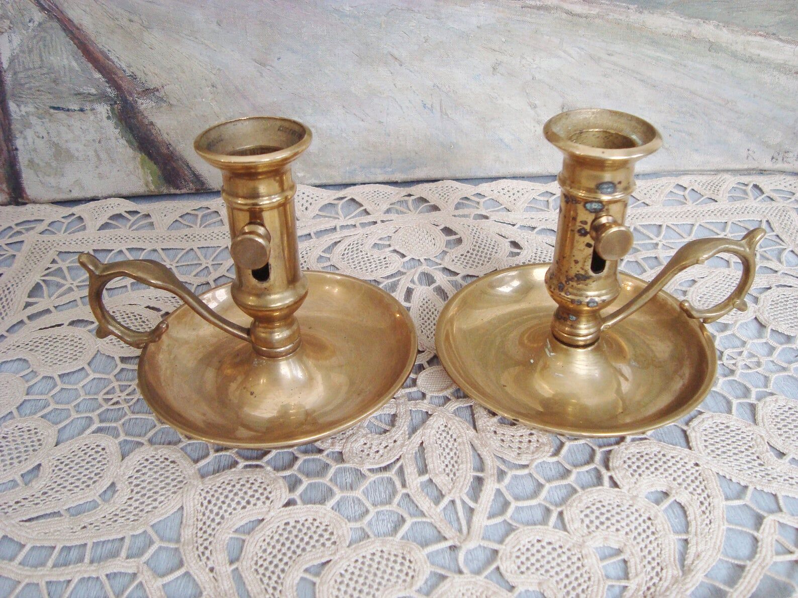 Pair of brass cellar rat candlesticks