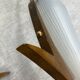 Pair of wall lights in brass, wood and opaline glass, 1950s/60s