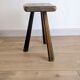 Antique tripod stool in patinated solid wood