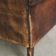 Vintage sheepskin wingback armchair in a deep brown colour finished