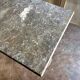 Grey marble and burgundy cast iron bistro table ☐ 85 x 57 cm