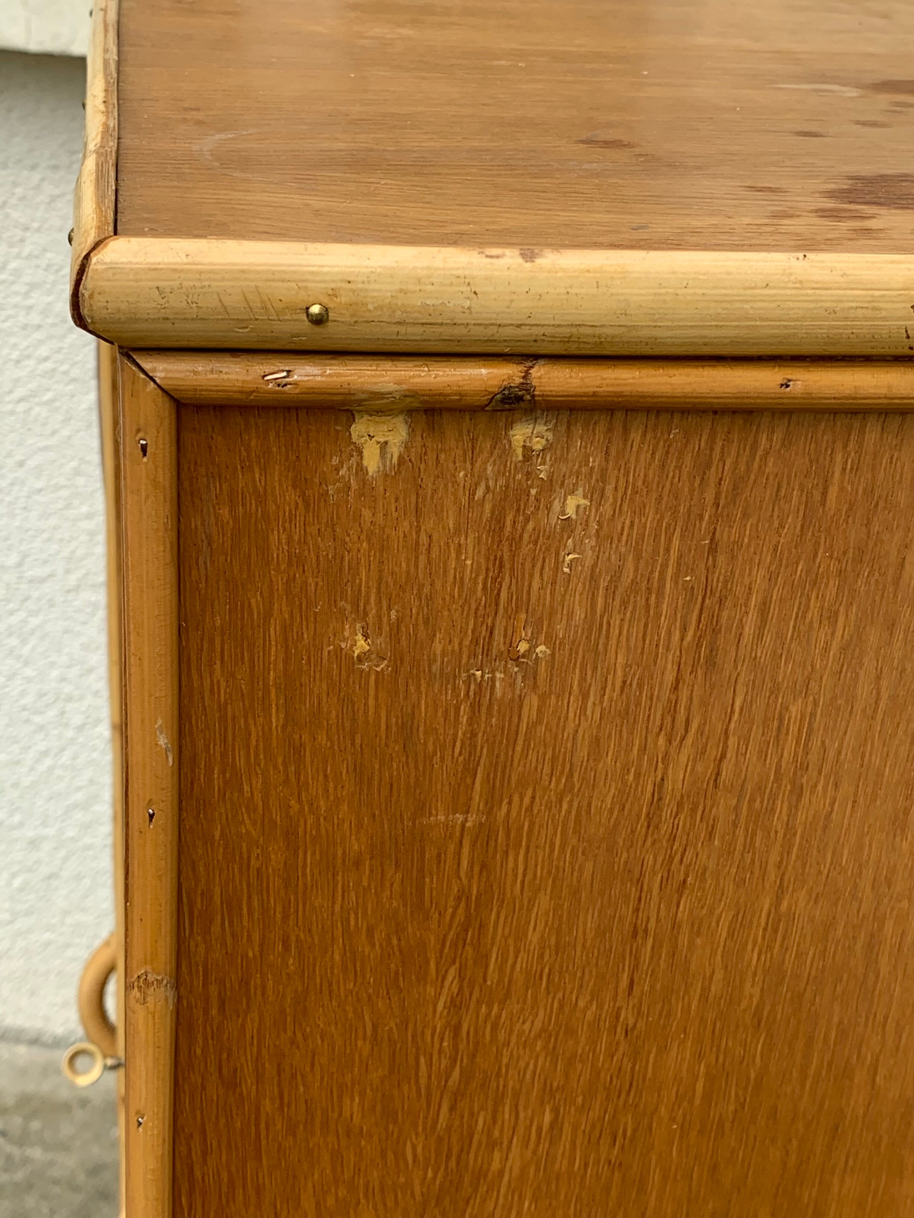 Rattan wardrobe with tapered legs from the 1960s.
