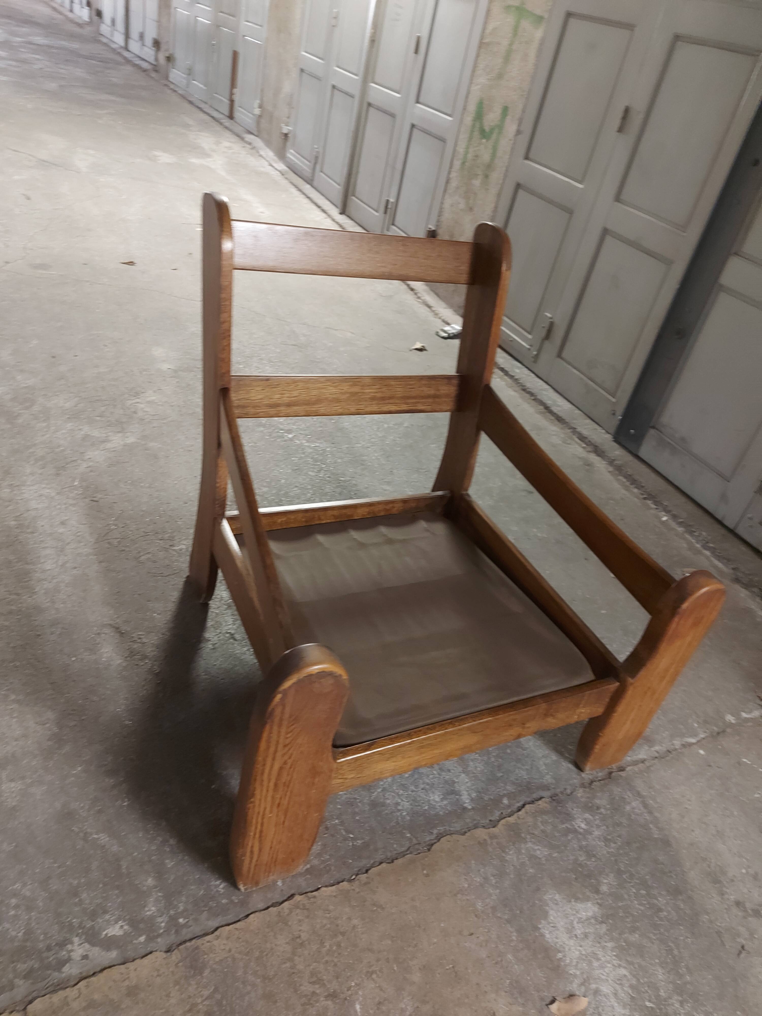 Armchairs in leather and vintage wood 70's