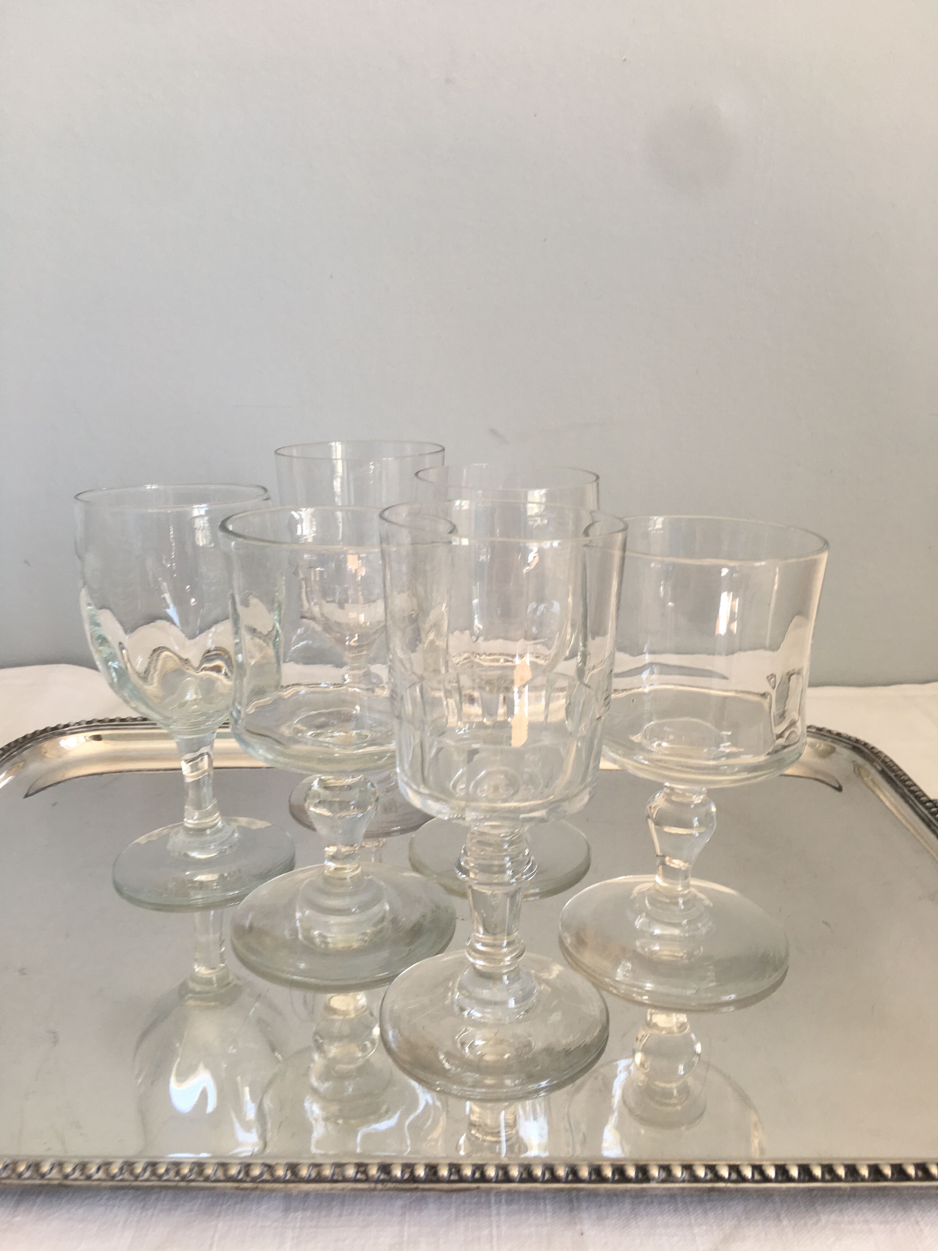 6 old mismatched water glasses