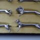12 animal knife holders Art Deco antique silver metal in case