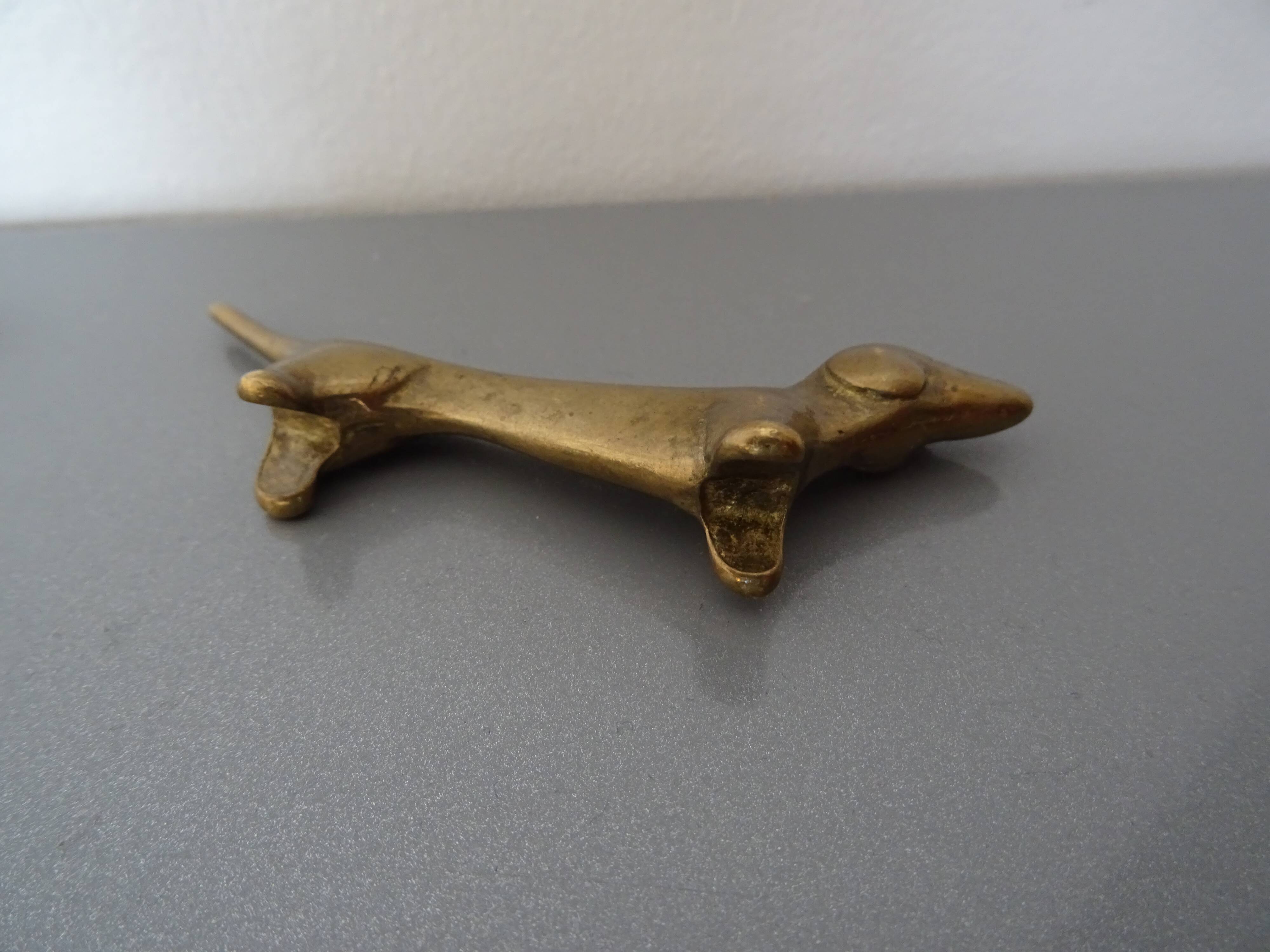Series of 6 vintage gilded brass dachshund knife holders