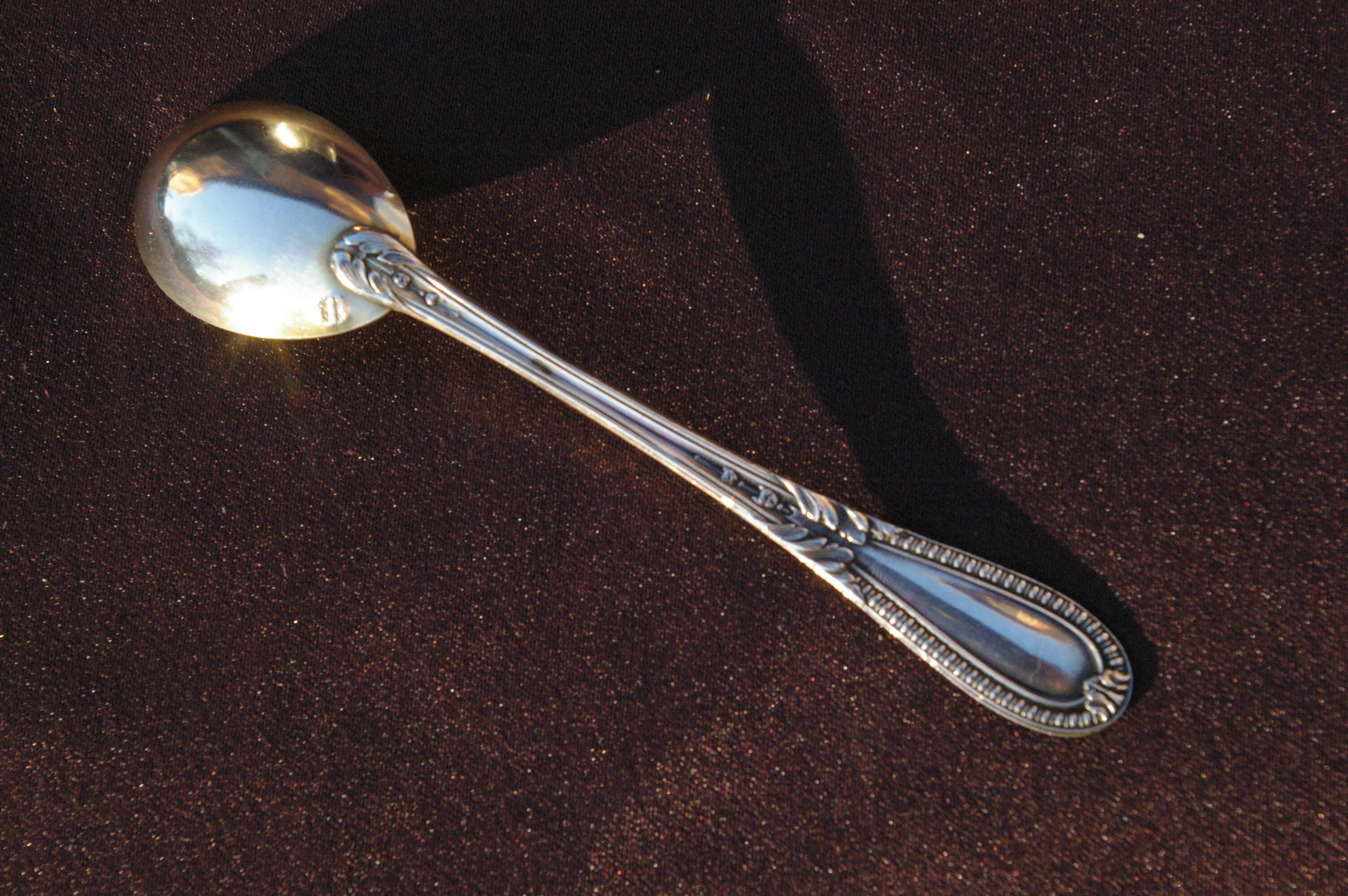 Egg spoon in solid silver and vermeil
