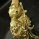 Pair of wall sconces with mask motifs in Empire style from the early 1900s - gilded bronze.