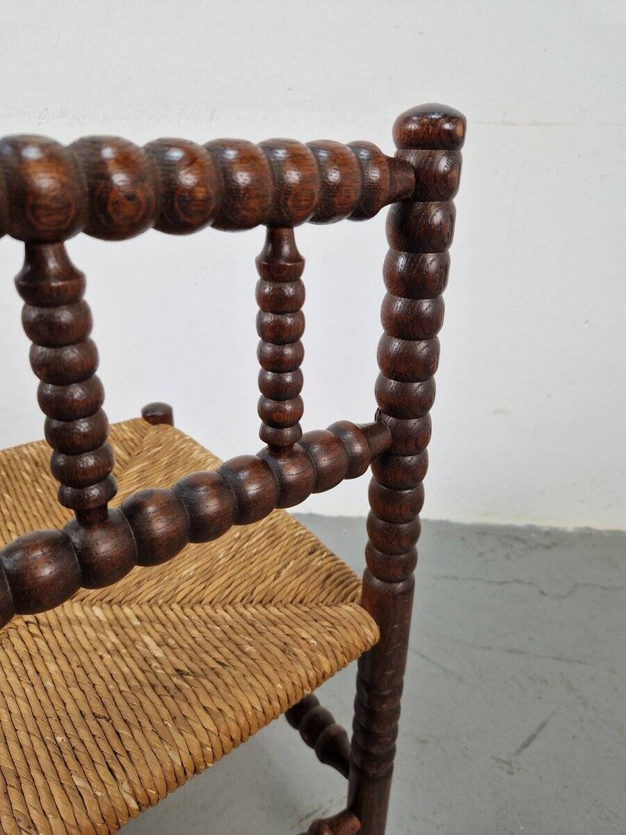Corner chair in Arts and Crafts style made of oak with a rush seat, 1950s.