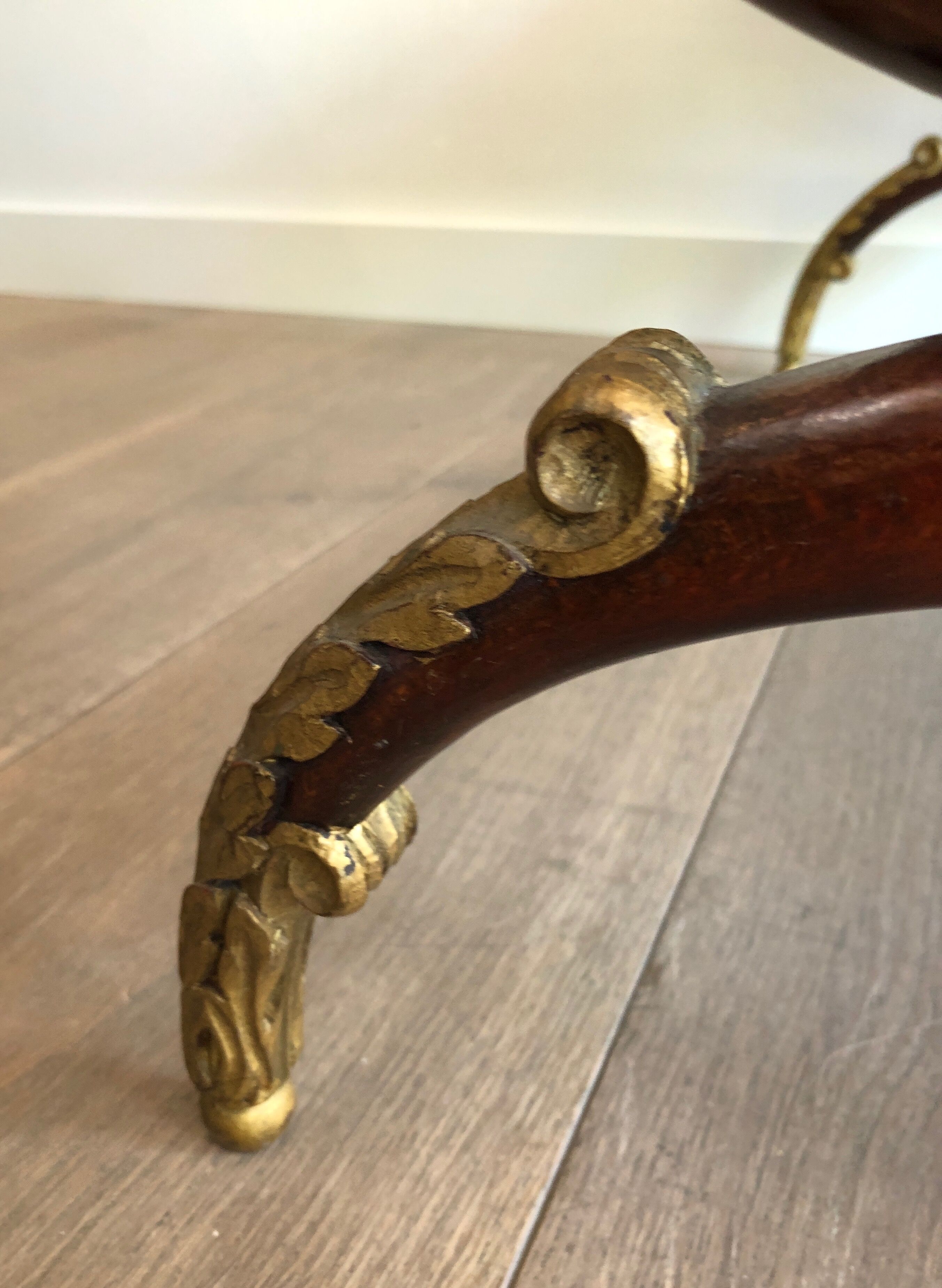 Coffee table in patinated and gilded carved wood with mirror top