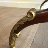 Coffee table in patinated and gilded carved wood with mirror top
