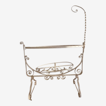 Old wrought iron cradle painted