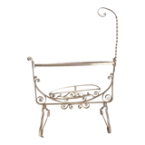 Old wrought iron cradle painted
