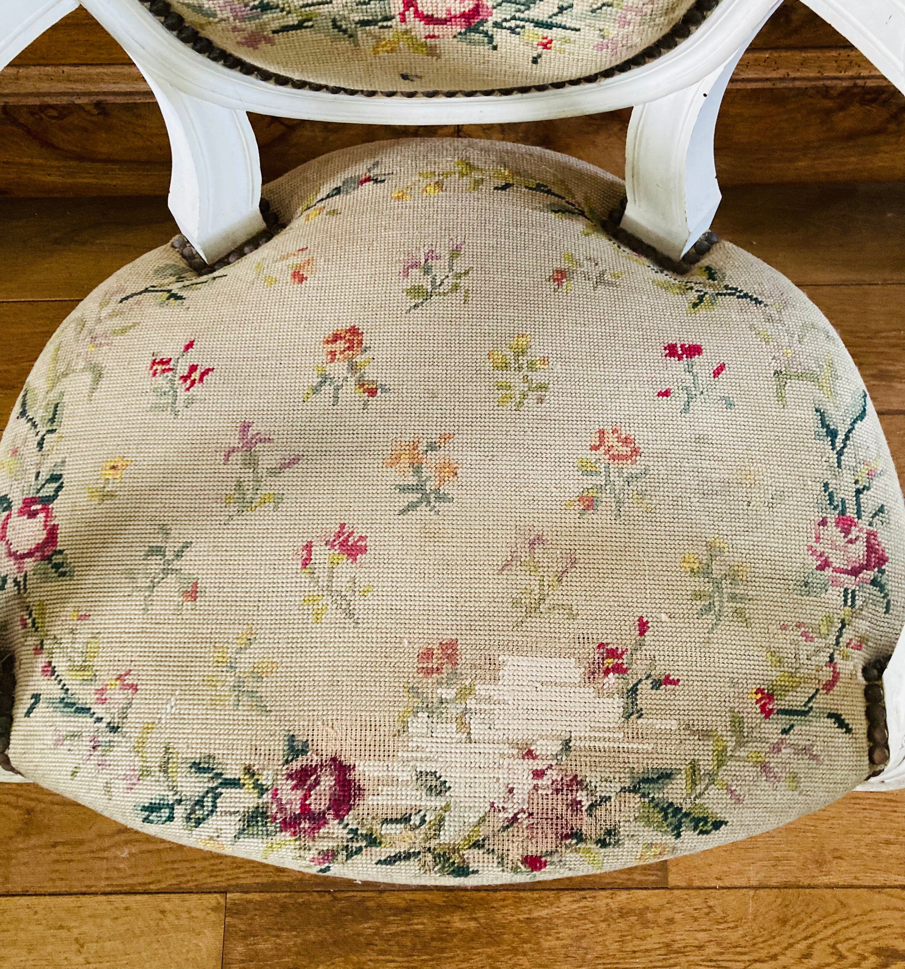 Upholstered armchair with cross-stitch in the Louis XVI style, 19th century.
