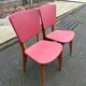 2 Scandinavian chairs in solid wood and burgundy leather from the 1970s.