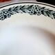 Old mismatched hollow plates in iron earth earthenware accompanied by a soup tureen