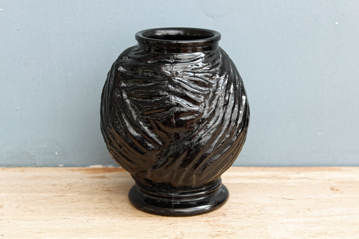 Molded glass vase, nubian's head