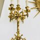 Massive gilded bronze chandeliers from the mid-20th century with marble bases.