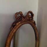 Miroir médaillon en bois doré - 43x24cm