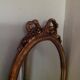 Miroir médaillon en bois doré - 43x24cm