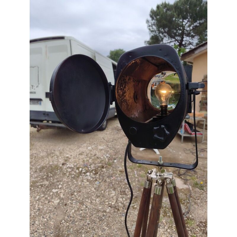 Spotlight on wooden and chrome tripod.