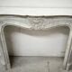 Louis XV style fireplace in veined white marble, 20th century.