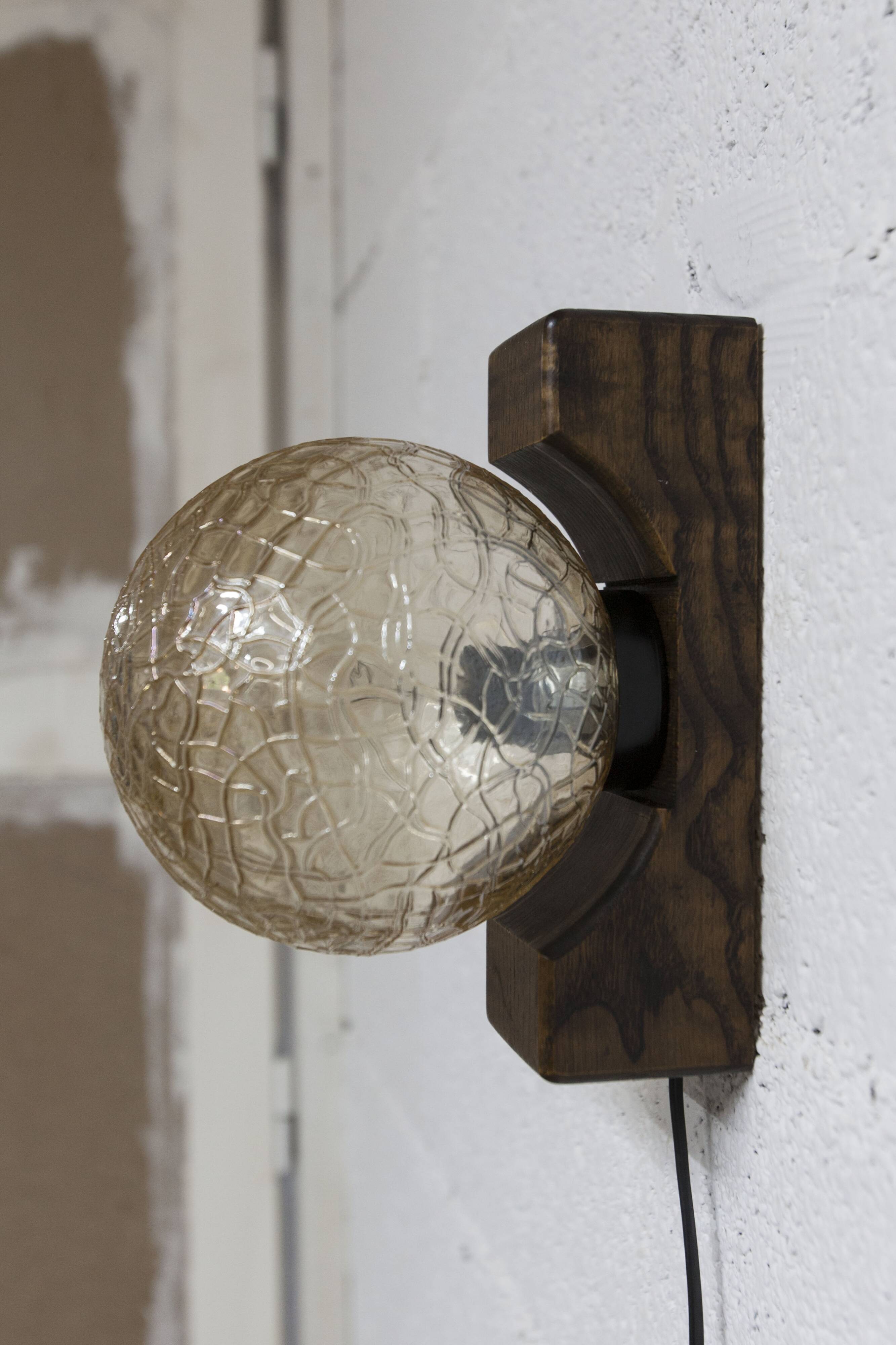 1960s ball wall light in dark wood and amber glass