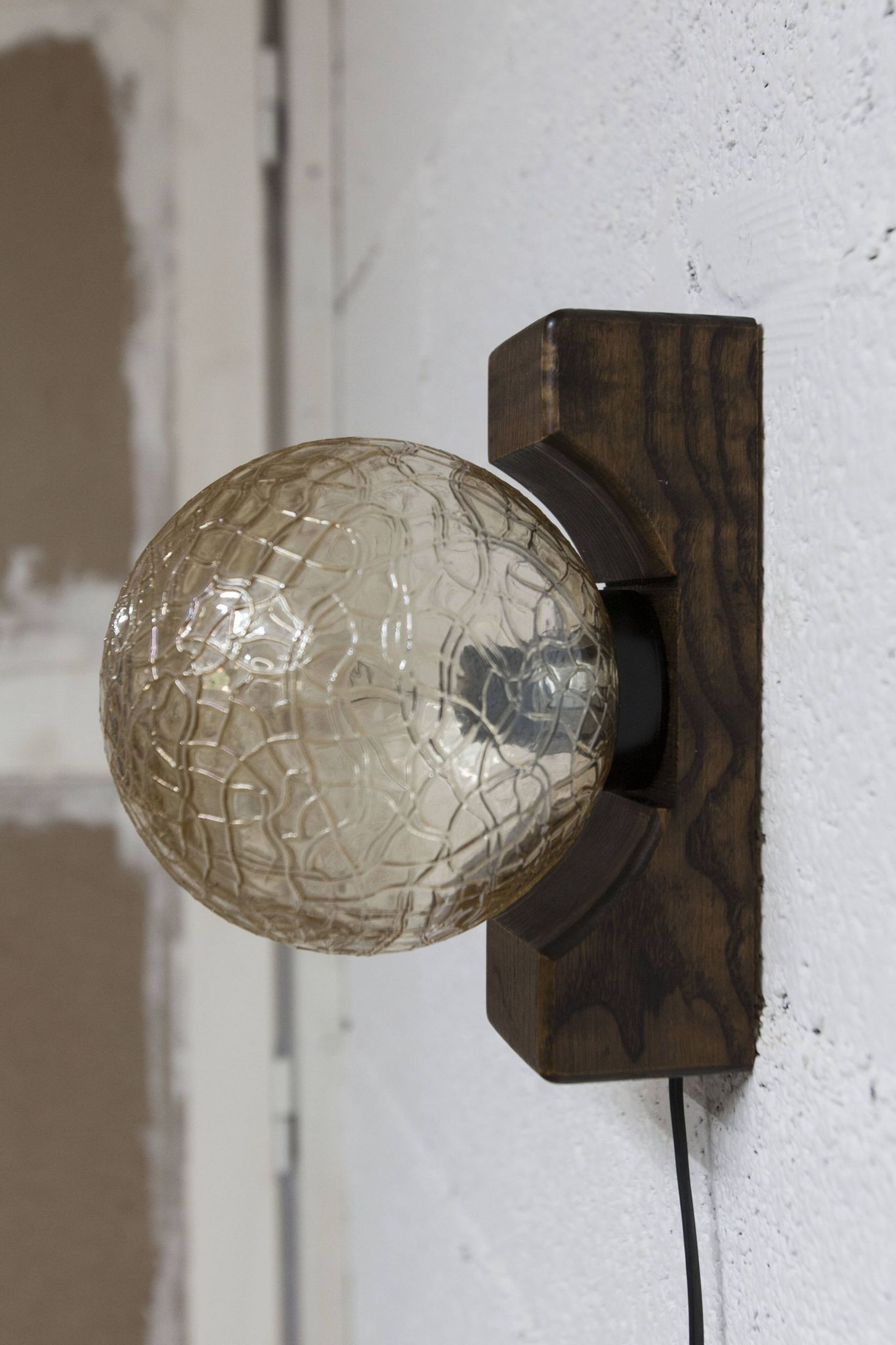 1960s ball wall light in dark wood and amber glass