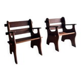 Set of two dark brown solid wood brutalist sculptural chairs with carved details