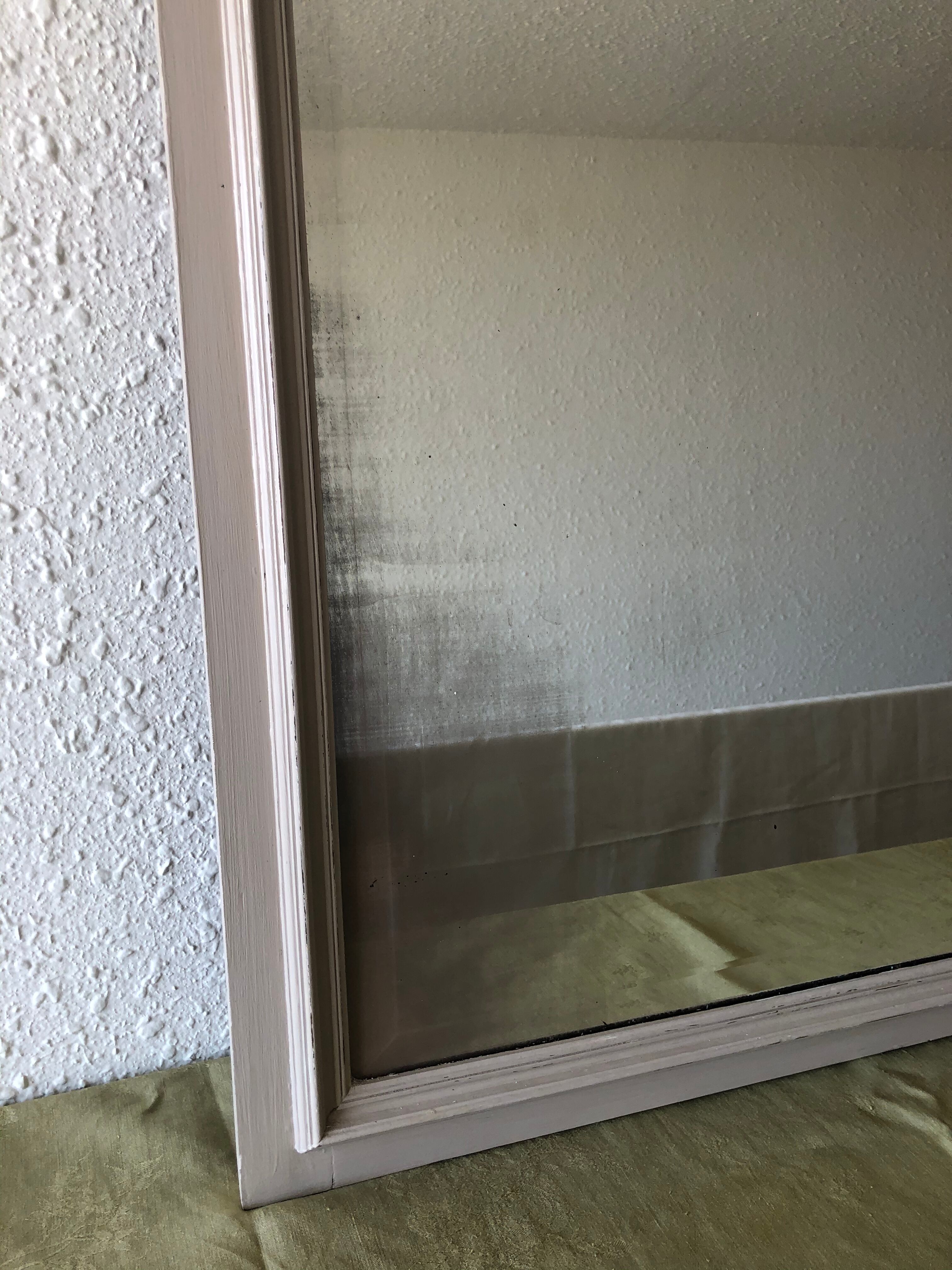 Large patinated wooden mirror with bevelled ice 73x113cm