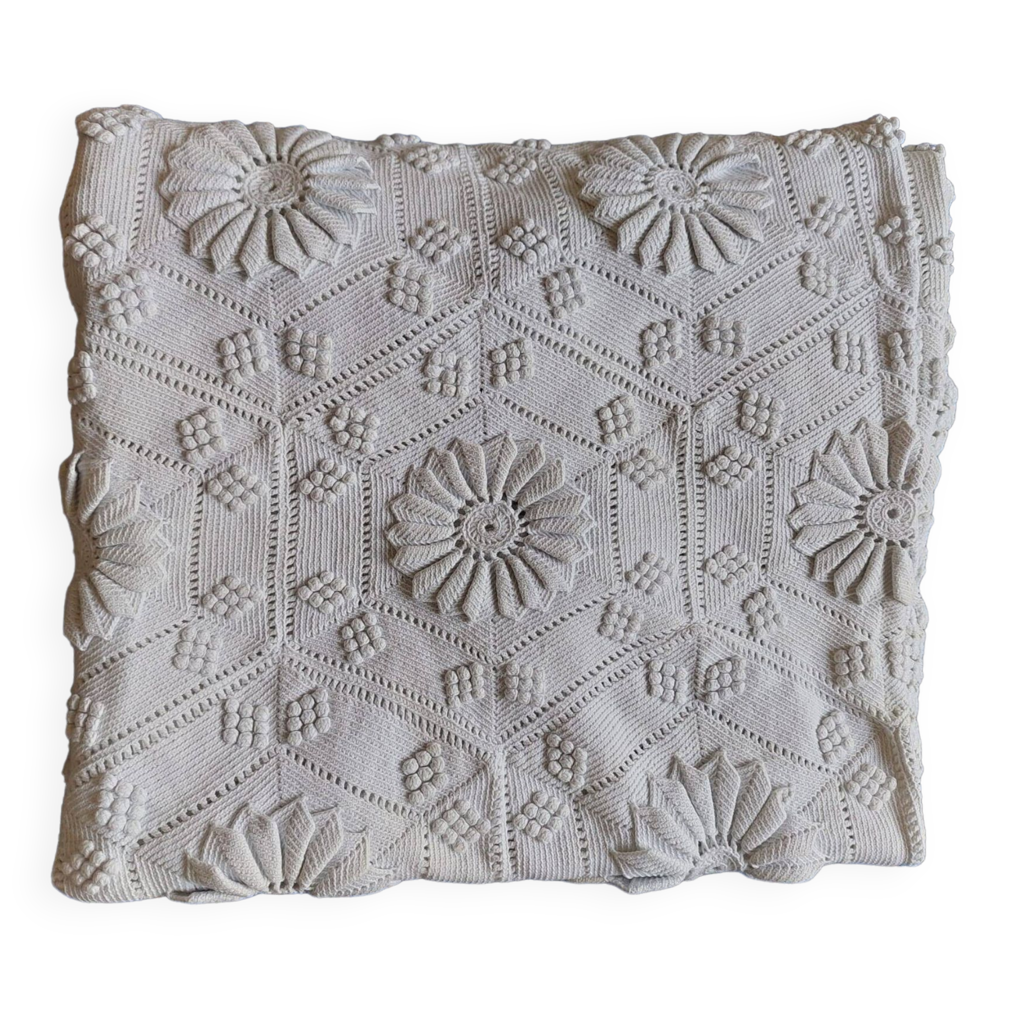 White bed throw with relief embroidery and floral patterns