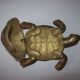 Golden brass ashtray has a turtle-shaped