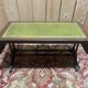 English Regency coffee table, mahogany & green stamped leather with gold.