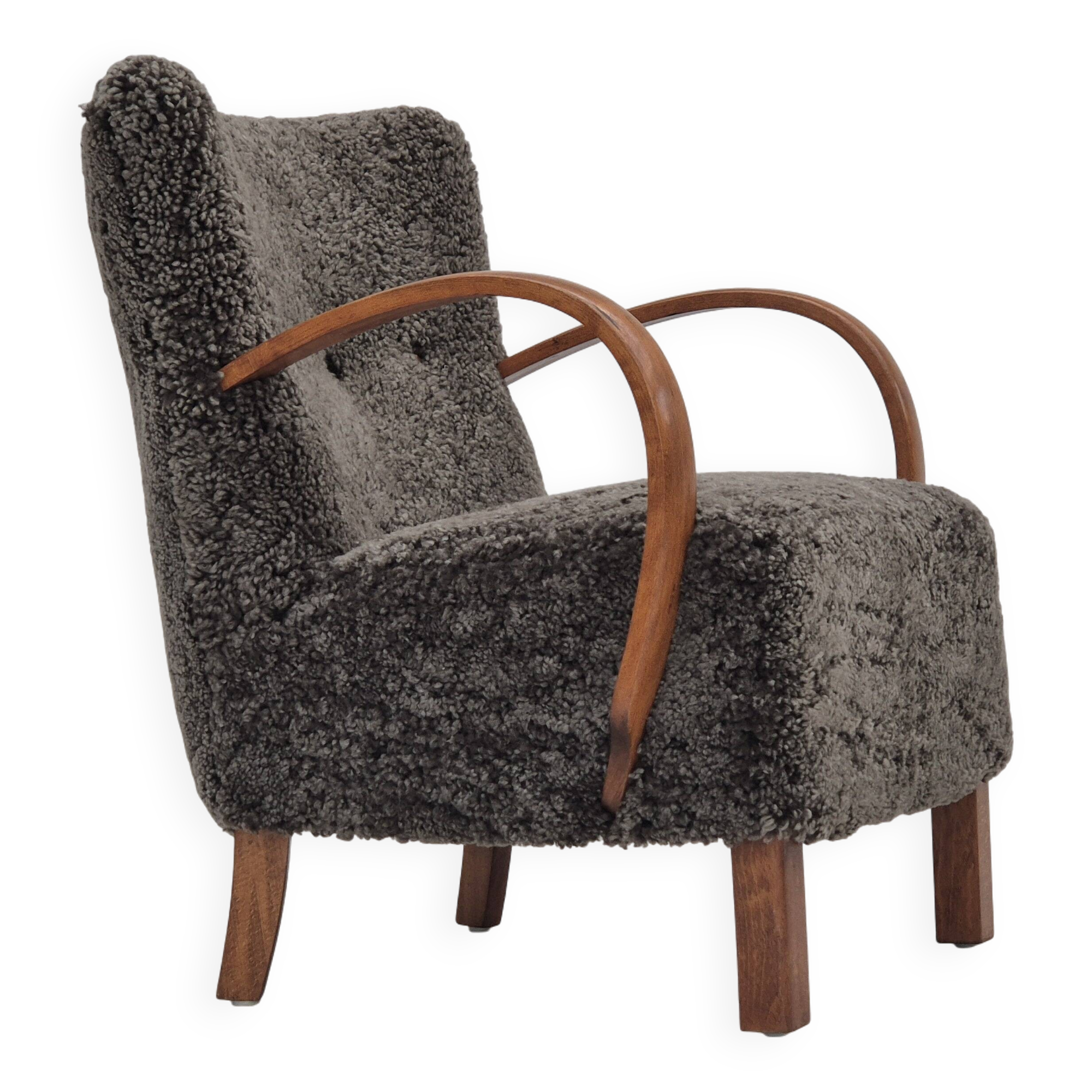 1960s, completely reupholstered Danish art deco armchair, genuine sheepskin "Wellington".