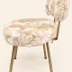Vintage 1960s dressing table chair with faux fur and golden legs.