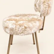 Vintage 1960s dressing table chair with faux fur and golden legs.