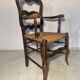 Antique Provencal armchair in carved wood with straw seat