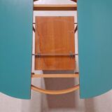 Extendable oval teak dining table