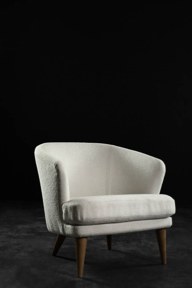 Low oak armchair with modern mid-century Scandinavian fabric and rounded backrest, 1960s.