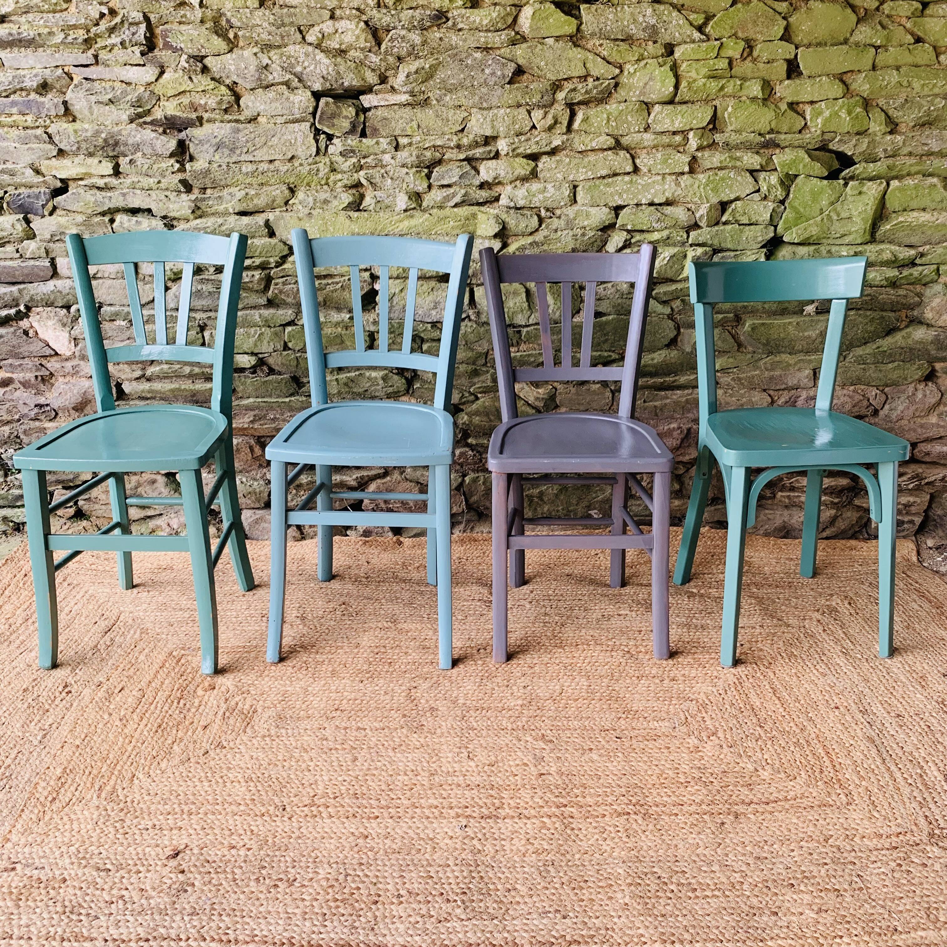 Set of four mismatched bistro chairs