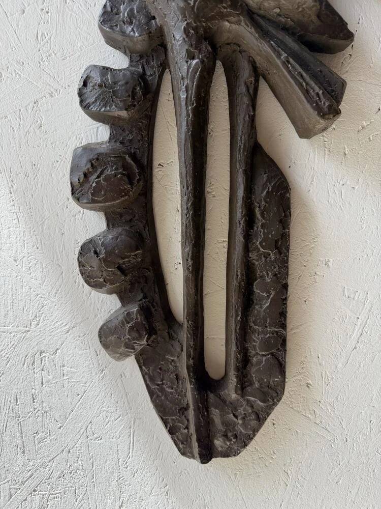 Brutalist wall sculpture with birds Ars Munda