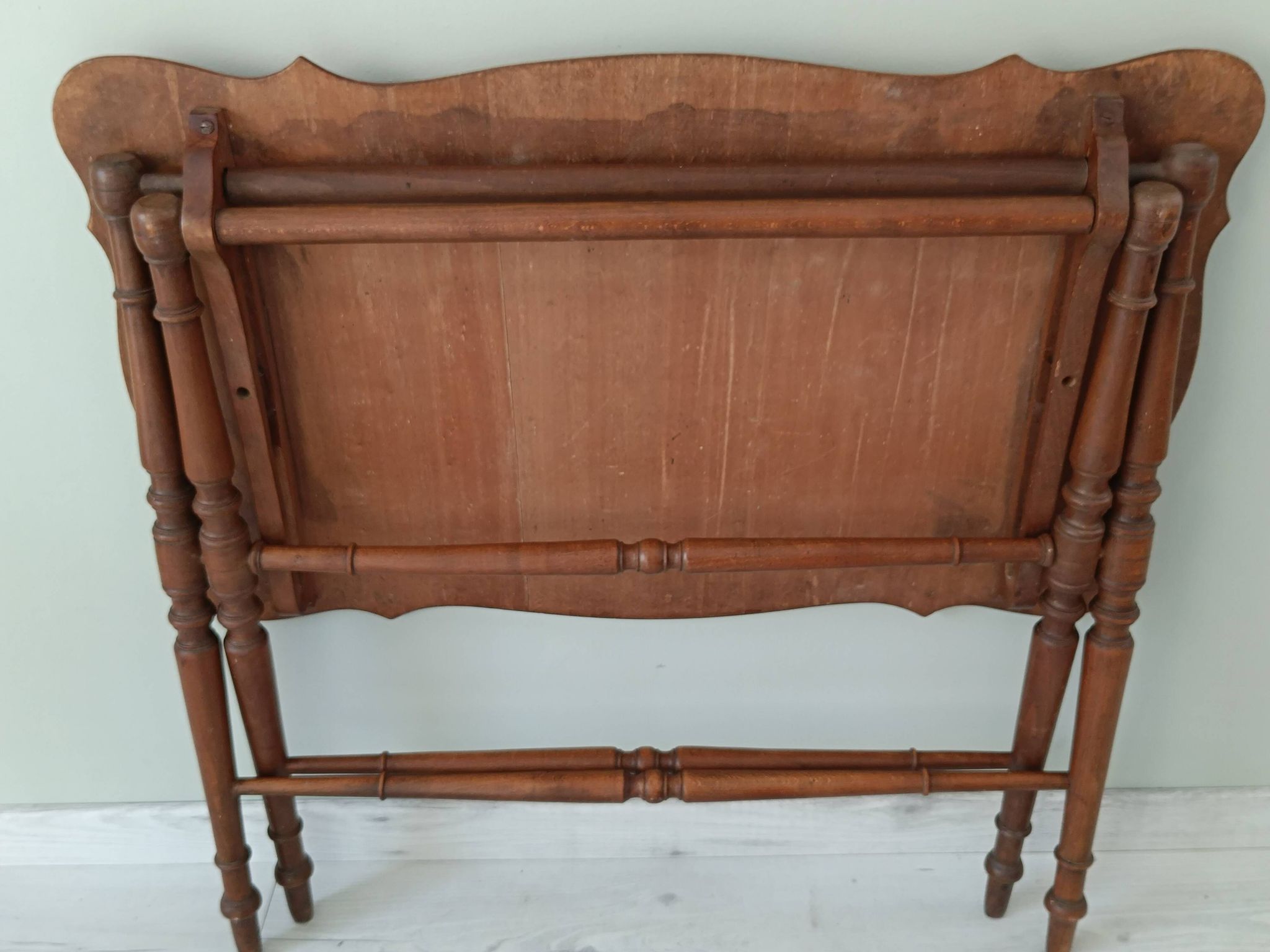 Vintage folding table with turned legs.