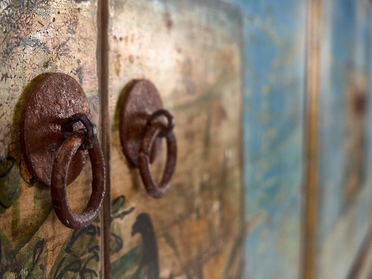 Old wooden entrance buffet in blue and yellow tones (circa 1920).