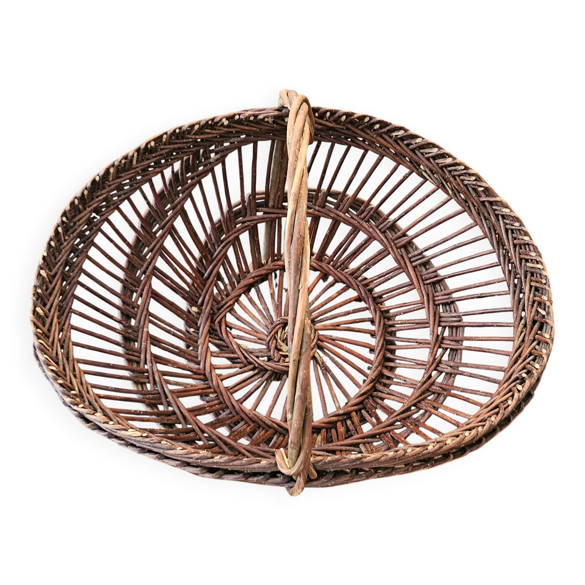 Vintage wicker basket with openwork, sun weaving and large handle.