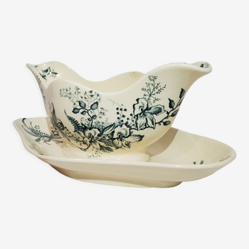 Gravy boat of the earthenware factory of Salins model Cyclamen, iron earth